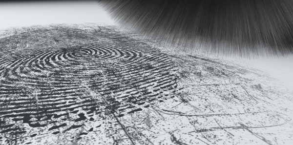 A crime scene brush dusting black talcum powder revealing and a fingerprint mark on an isolated white background