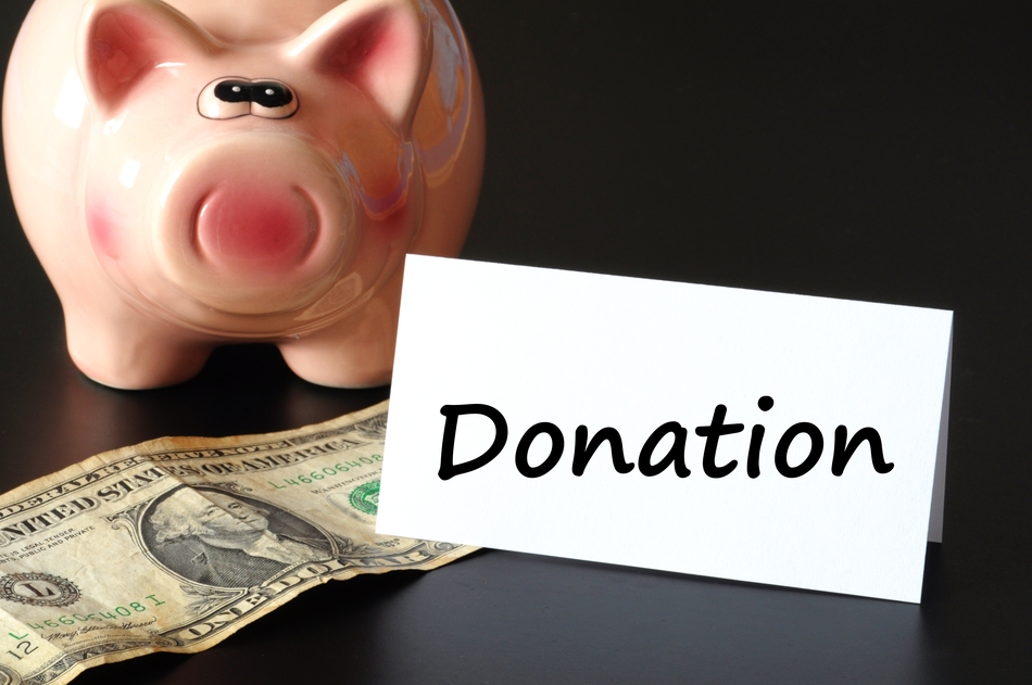 donation or donate concept with piggy  bank on black background