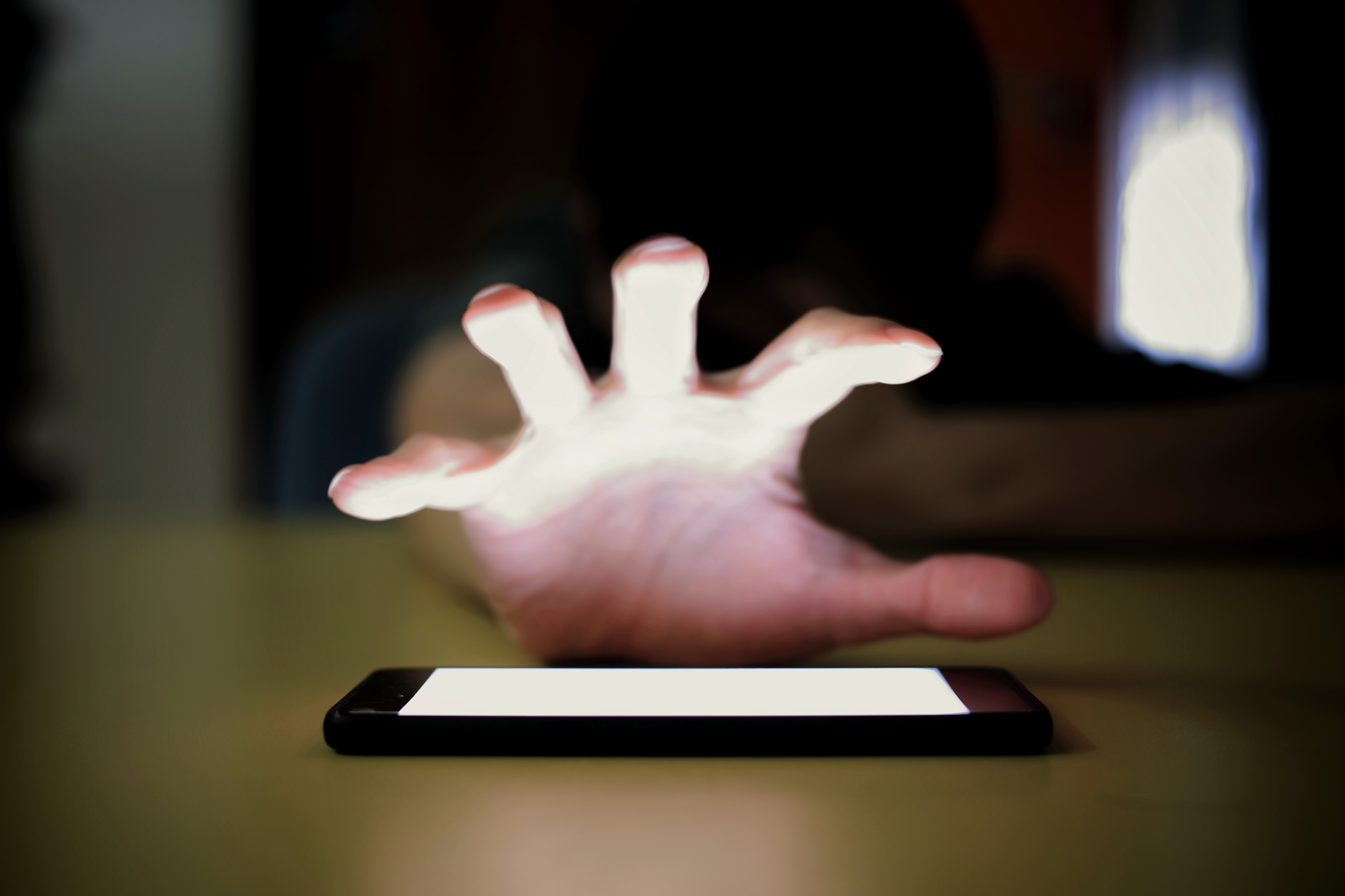 Phone Attacking Hand Data and device security for domestic abuse survivors | Malwarebytes Labs