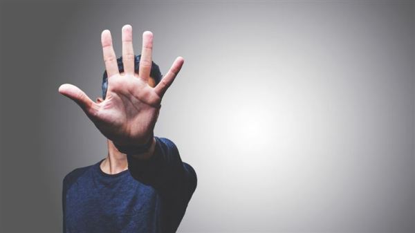 extended hand meaning stop