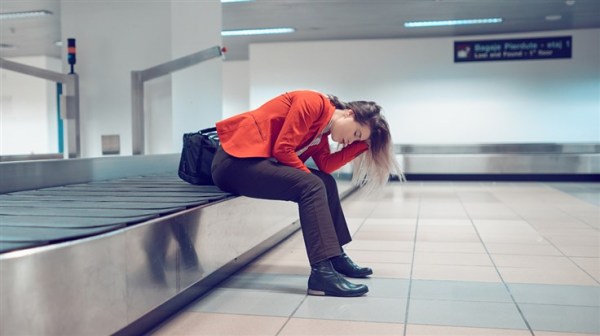Woman upset at having lost her luggage.