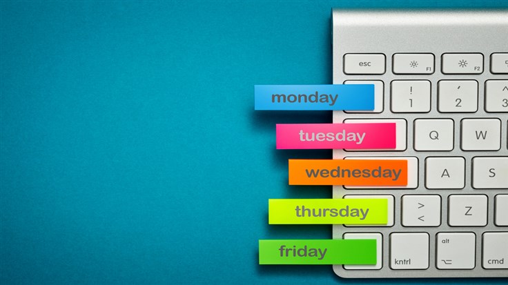 white keyboard with colourful tags on the days of the week