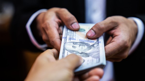 A blackmailer taking money