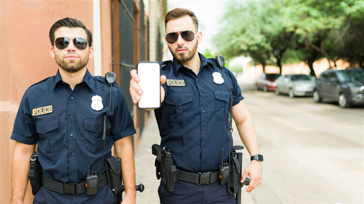 police officers showing a mobile phone