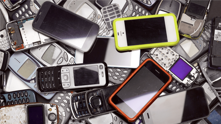 a pile of old and broken phones
