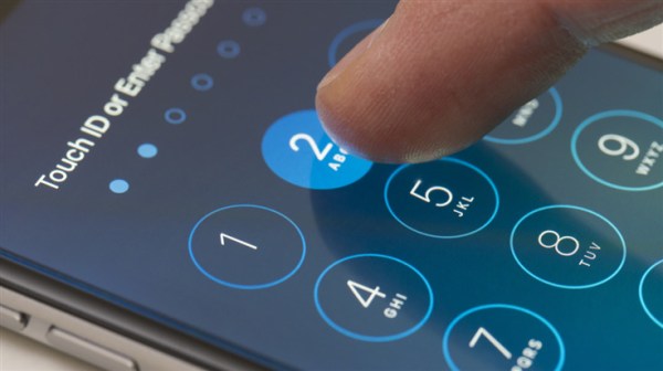 finger entering iPhone passcode