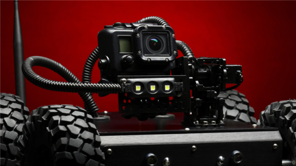 camera mounted on cart with all-terrain wheels