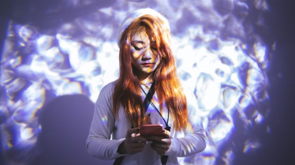 teen on phone with a chatbot