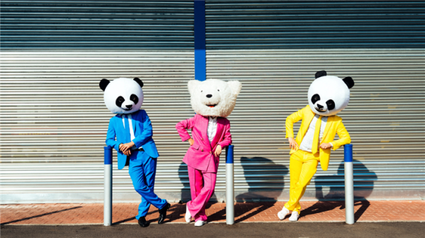 People wearing stuff toy heads