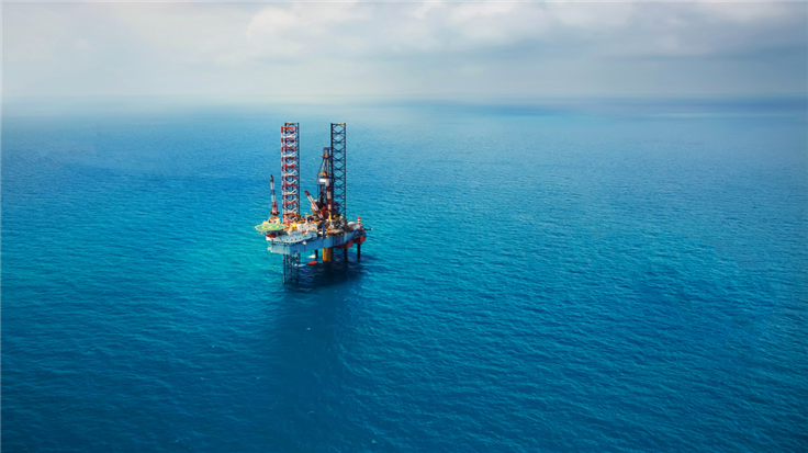 oil rig in a large blue sea