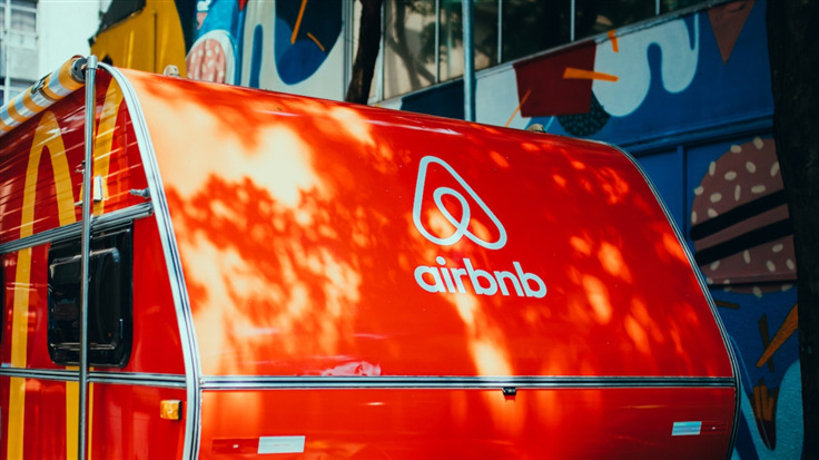 airbnb logo behind a red trailer