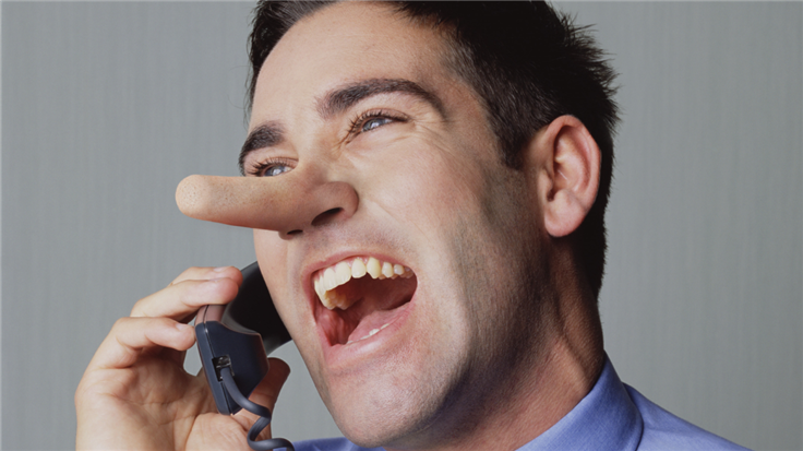 a man with a long Pinocchio nose talking on the phone