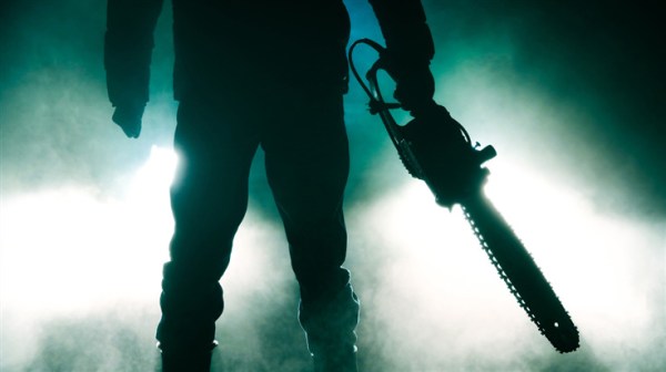 person with chainsaw