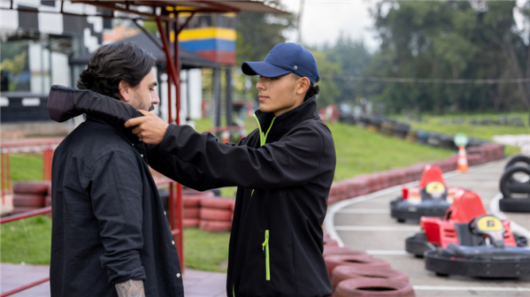 Karter putting a hoodie on his partner