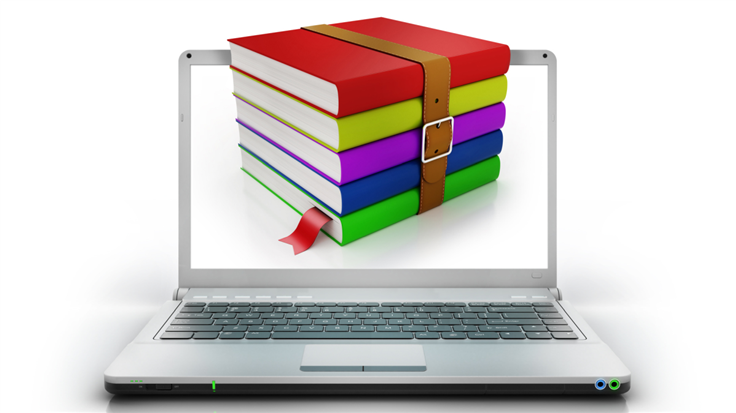 stack of colored books on a laptop