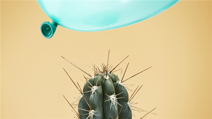 balloon close to a cactus