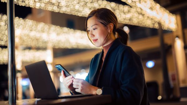 Woman using 2FA factor on her phone