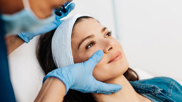 plastic surgeon working on face