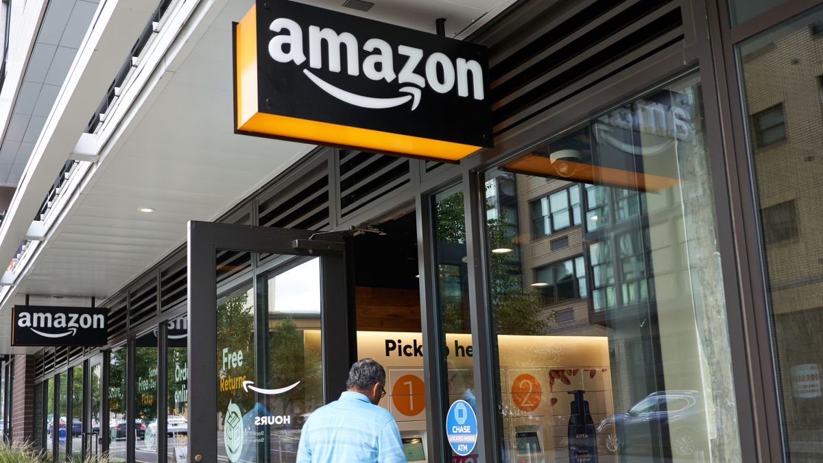 Man entering a building with an Amazon pick-up location