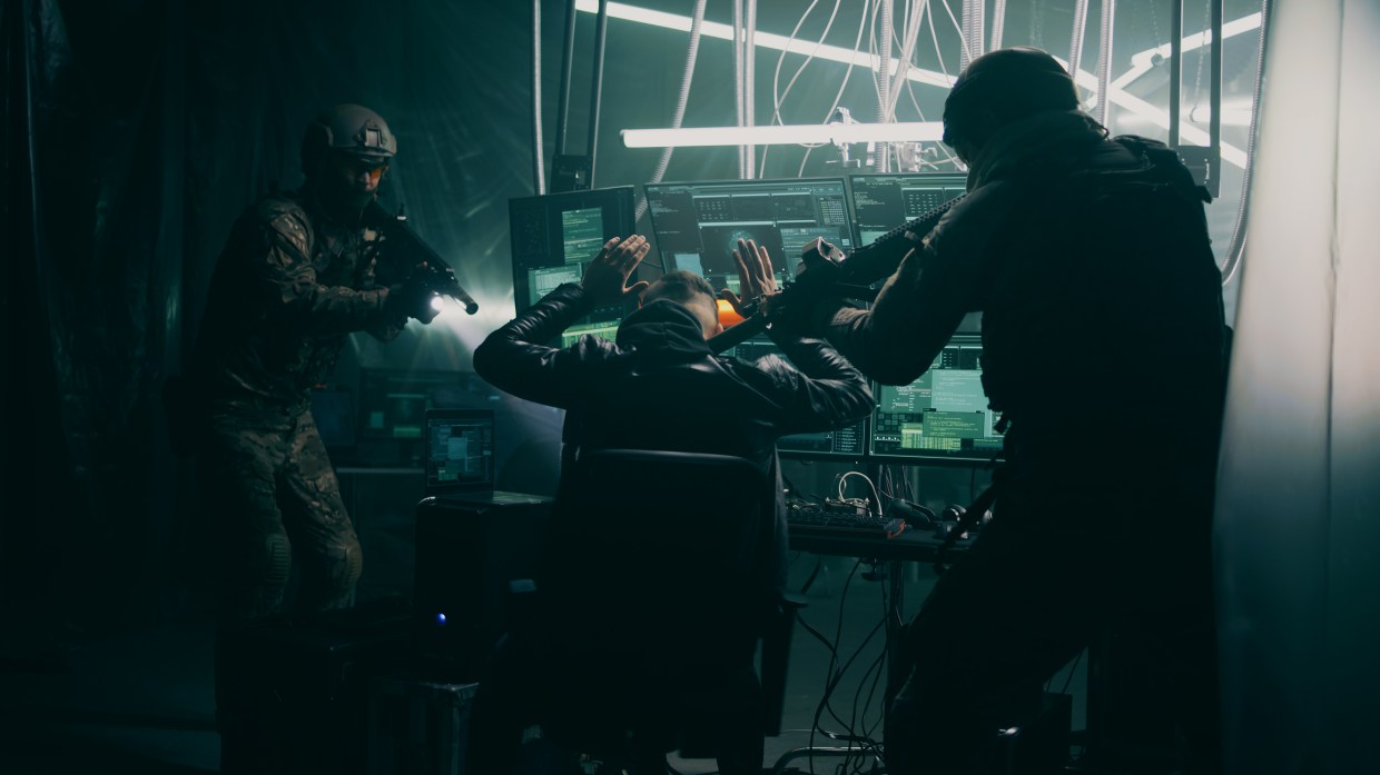 Armed law enforcement raid a hacker's headquarters