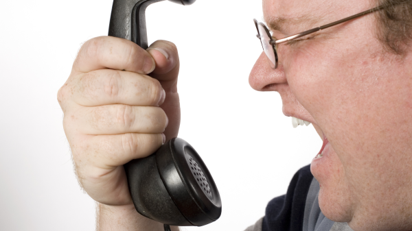 man screaming at robocaller