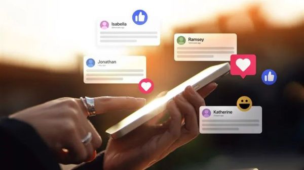 Hand holding mobile phone with generic social media push notifications hovering above it