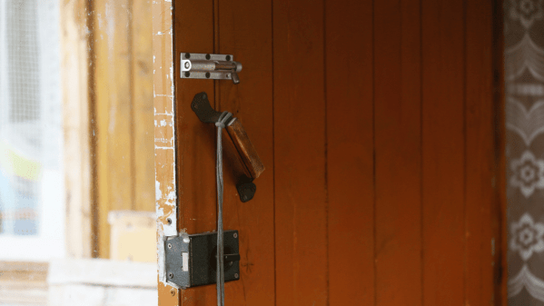 An open door with several locks on it