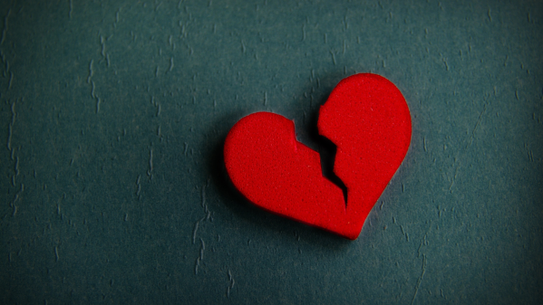 A heart shape with a large crack in it.