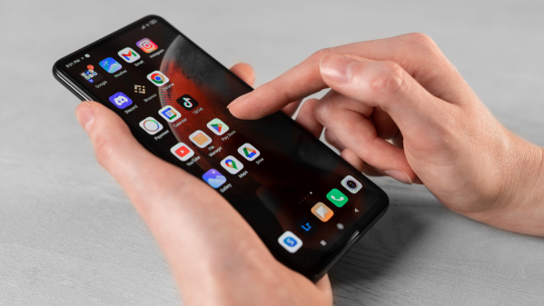 Close up of someone pressing icons on an Android