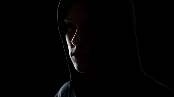 Image of man in the shadows