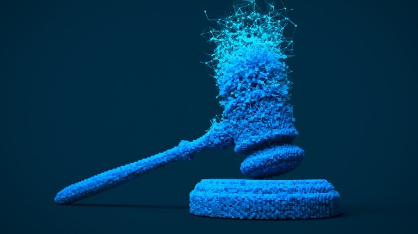 A digitally rendered gavel is splintering into different data points and nodes.