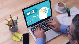 man taking online quiz on laptop