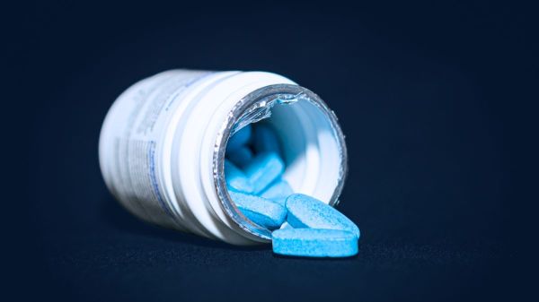 Spilled bottle of blue pills