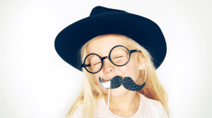 girl using a fake mustache