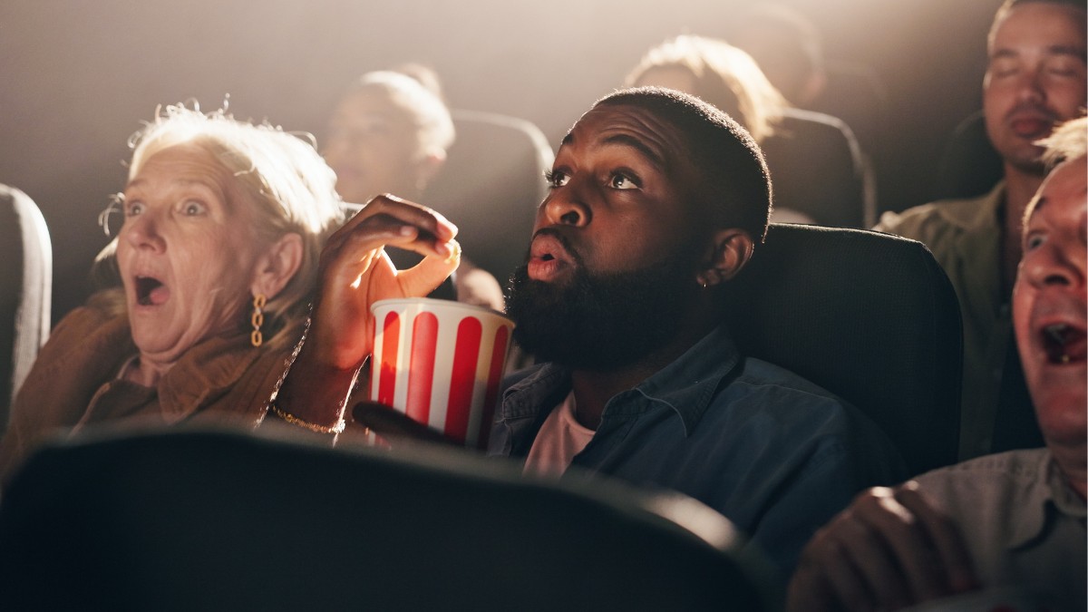 Eating popcorn and watching something shocking