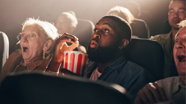 Eating popcorn and watching something shocking